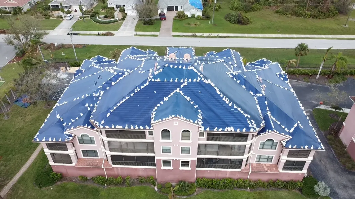 Emergency roof tarping on commercial building